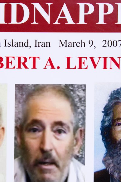 In this March 6, 2012, file photo, an FBI poster showing a composite image of former FBI agent Robert Levinson, right, of how he could look after five years in captivity, and an image, center, taken from the video released by his kidnappers, and a picture before he was kidnapped, left, displayed during a news conference in Washington.