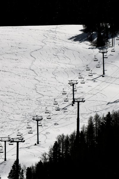 This Tuesday, March 24, 2020 photo shows ski lifts empty in Vail, Colo., after Vail Ski Resort closed for the season amid the COVID-19 pandemic.