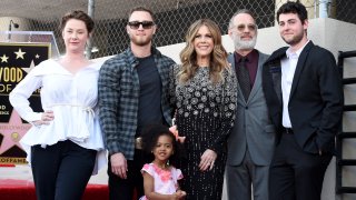 Chet Hanks (second left), Rita Wilson, Tom Hanks and Truman Hanks attend the ceremony honoring Rita Wilson with a star on the Hollywood Walk of Fame