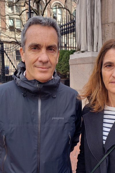 In this March 11, 2020 photo, Gianmarco de Felice and his wife, Annaelisa Lugini pose for a photo outside Columbia University in New York City. Italians in New York are worried for loved ones in Italy who are living under a nationwide lockdown to stem the spread of the new coronavirus. De Felice is in New York for a few months doing research. Lugini has been visiting and had been planning to return to Italy earlier this week, but decided to stay to avoid the lockdown. For most people, the new coronavirus causes only mild or moderate symptoms. For some it can cause more severe illness.