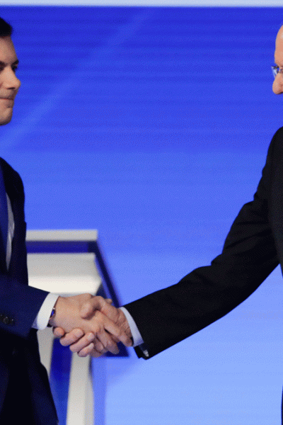 Democratic presidential candidates former South Bend Mayor Pete Buttigieg and Sen. Bernie Sanders, I-Vt., shake hands on stage Friday, Feb. 7, 2020, before the start of a Democratic presidential primary debate hosted by ABC News, Apple News, and WMUR-TV at Saint Anselm College in Manchester, N.H.