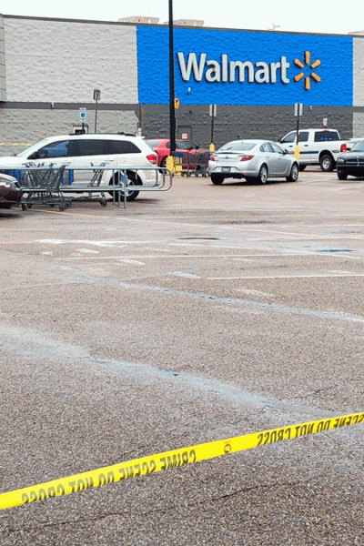 Police tape blocks off a Walmart store parking lot in Forrest City, Ark., on Monday, Feb. 10, 2020. Police say at least three people, including two officers, have been shot this Walmart in eastern Arkansas.