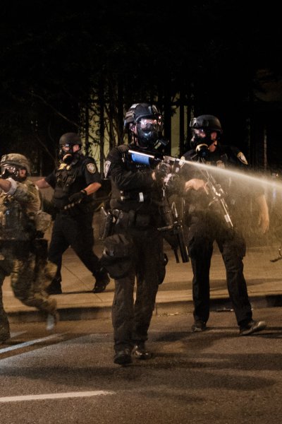 Federal officers use tear gas and other crowd dispersal munitions on protesters outside the Multnomah County Justice Center on July 17, 2020 in Portland, Oregon. Federal law enforcement agencies attempt to intervene as protests continue in Portland.