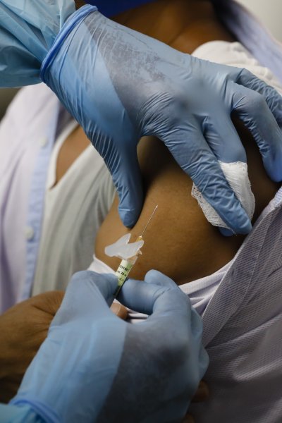 In this Sept. 9, 2020, file photo, a health worker injects a person during clinical trials for a COVID-19 vaccine at Research Centers of America in Hollywood, Florida.