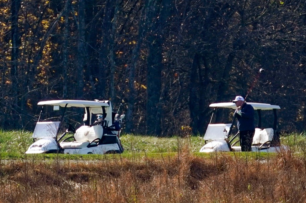 President Donald Trump participates in a round of golf at the Trump National Golf Course on Saturday, Nov. 7, 2020, in Sterling, Va.