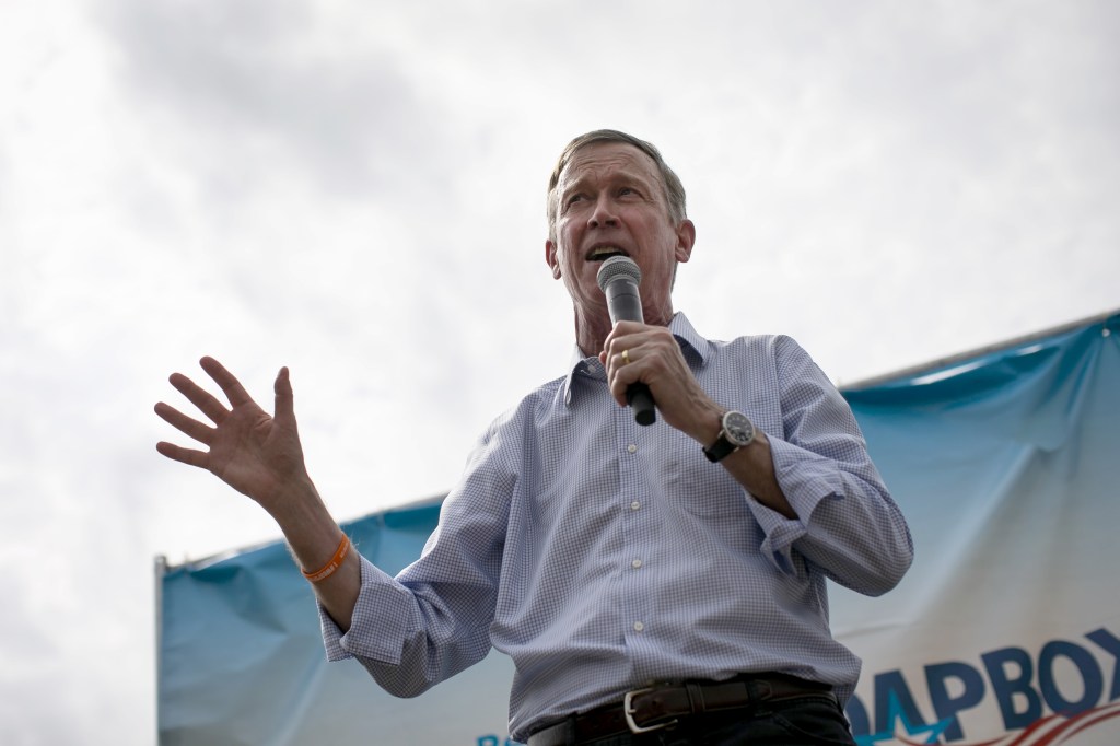 John Hickenlooper, former governor of Colorado and 2020 presidential candidate, speaks at the Des Moines Register Soapbox during the Iowa State Fair in Des Moines, Iowa, U.S., on Saturday, Aug. 10, 2019. 