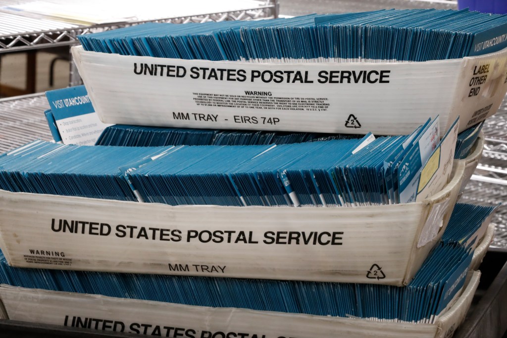 Returned ballots, where the voter could not be located, are stacked in United States Postal Service containers during the 2020 Presidential election in Provo, Utah, U.S., on Tuesday, Nov. 3, 2020.