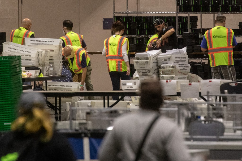 Election workers count ballots at the Philadelphia Convention Center on November 06, 2020 in Philadelphia, Pennsylvania. 