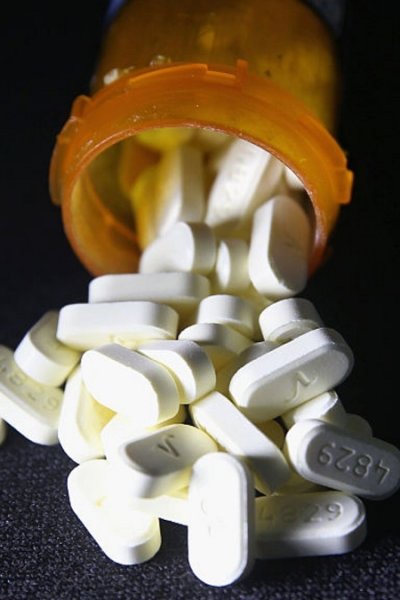 Opioid pills in a prescription bottle