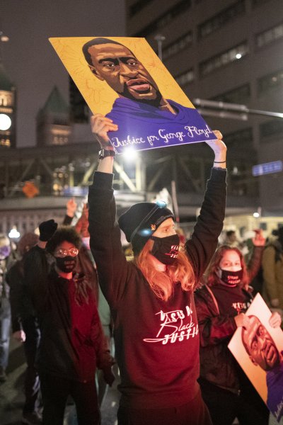 In this April 9, 2021, file photo, protesters, demanding justice for George Floyd, gather in front of the Hennepin County Government Center, where the trial of former Minneapolis police officer Derek Chauvin has been ongoing, to stage a protest and march through the streets of downtown Minneapolis, Minnesota.