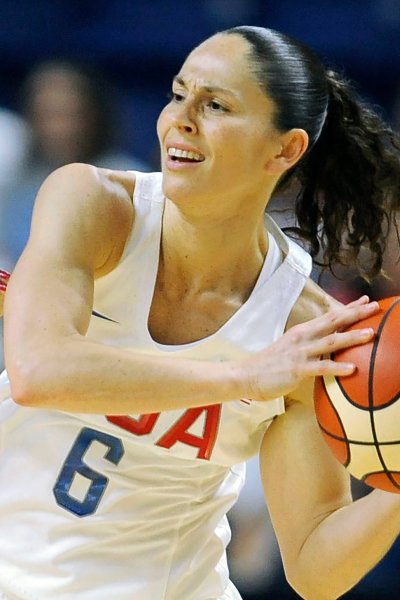 FILE - United States' Sue Bird, right, is defended during the first half of a women's exhibition basketball game against Canada in Bridgeport, Conn., in this Friday, July 29, 2016, file photo. Sue Bird and Diana Taurasi will try and become the first five-time Olympic gold medalists in basketball as they lead the U.S women's team at the Tokyo Games. The duo was selected for their fifth Olympics on Monday, June 21, 2021, joining Teresa Edwards as the only basketball players in U.S. history to play in five.