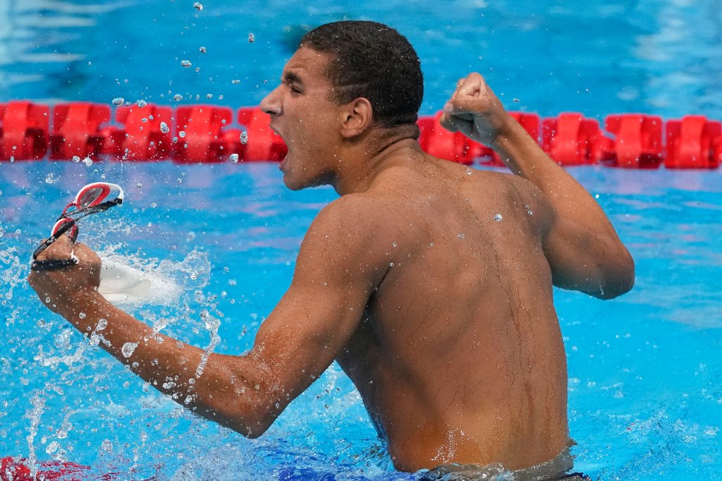 Ahmed Hafnaoui, of Tunisia, celebrates after winning the final of the men's 400-meter freestyle at the 2020 Olympics on July 25, 2021, in Tokyo, Japan.