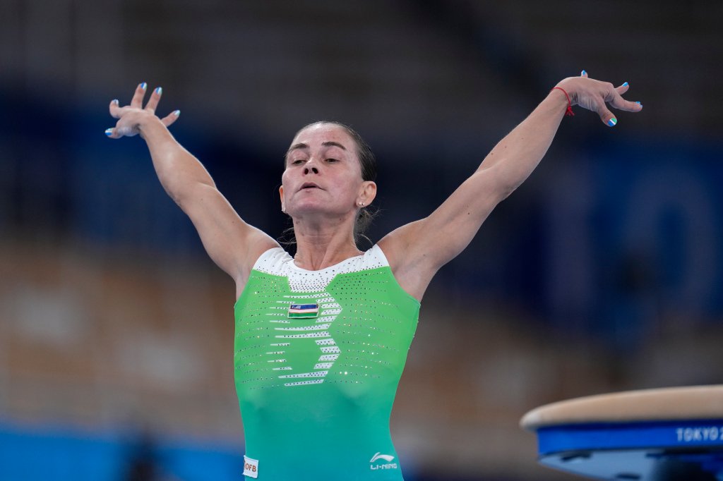 Oksana Chusovitina, of Uzbekistan, performs on the vault during the women's artistic gymnastic qualifications at the 2020 Summer Olympics, Sunday, July 25, 2021, in Tokyo. 