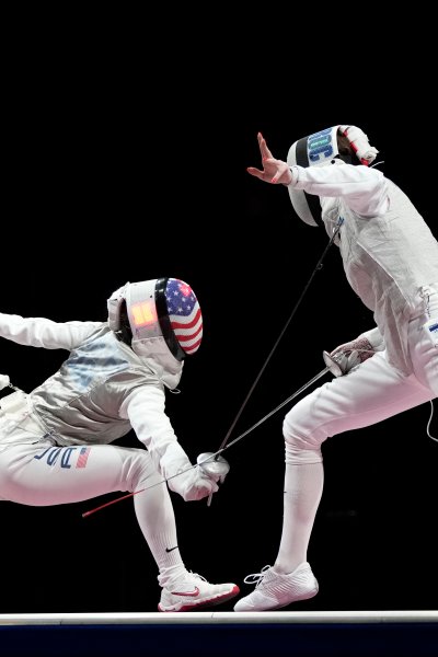 Inna Deriglazova of the Russian Olympic Committee, right, and Lee Kiefer of the United States compete in the women's individual Foil final competition at the 2020 Summer Olympics, Sunday, July 25, 2021, in Chiba, Japan. Kiefer beat out Deriglazova for gold, becoming the first American to medal at the individual foil event.