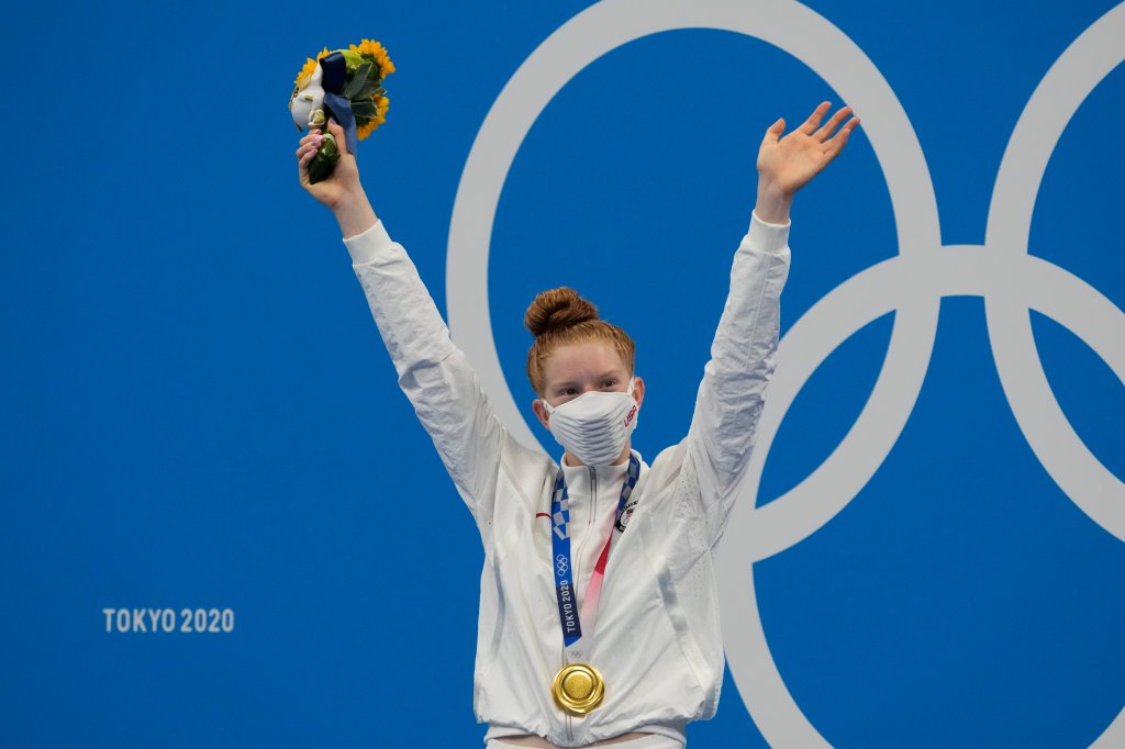 Lydia Jacoby, of the United States, poses with the gold medal after winning the final of the women's 100-meter breaststroke at the 2020 Olympics on July 27, 2021, in Tokyo, Japan.