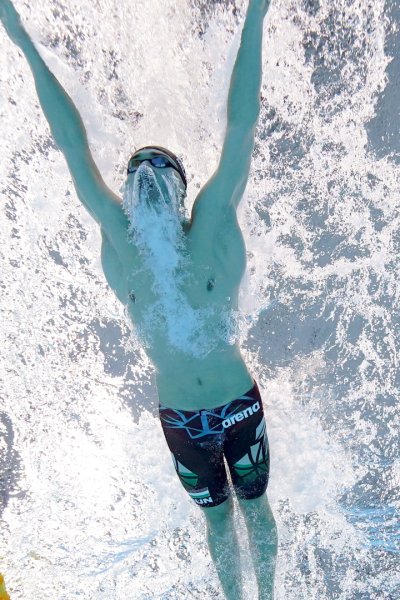 Swimmer Kristof Milak races overhead