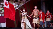 Flag bearers Malia Paseka and Pita Taufatofua of Team Tonga lead their team out during the Opening Ceremony of the Tokyo 2020 Olympic Games at Olympic Stadium on July 23, 2021 in Tokyo, Japan.
