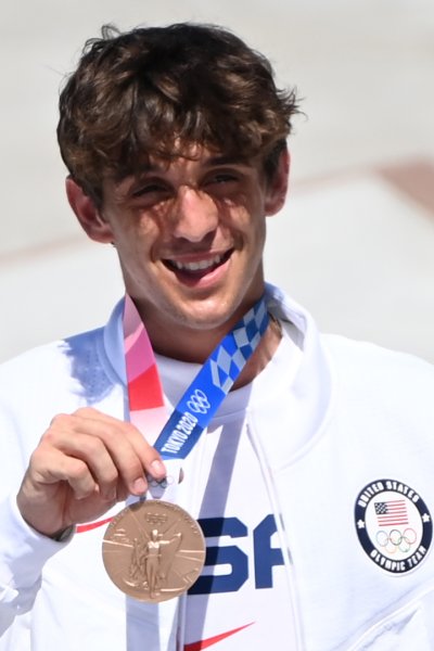 Cory Juneau posing with his bronze medal.