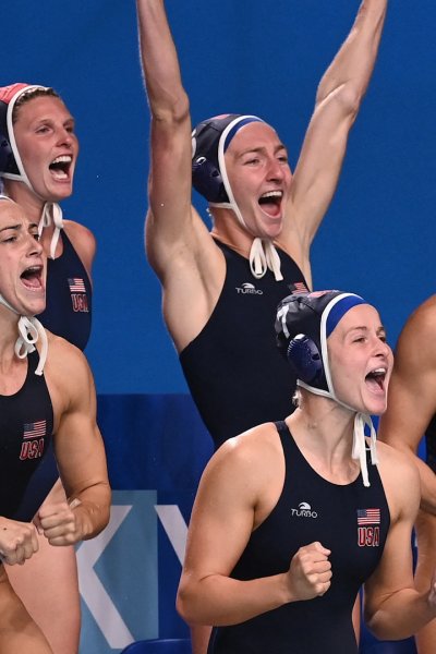 The U.S. women's water polo team celebrates after defeating the ROC.