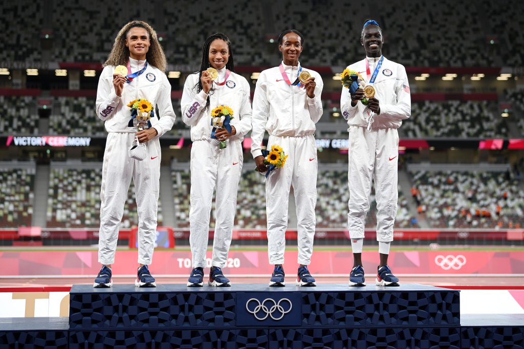 Gold medalists Allyson Felix, Athing Mu, Dalilah Muhammad and Sydney McLaughlin of Team United States stand on the podium during the medal ceremony for the Women's 4x400m Relay on day fifteen of the Tokyo 2020 Olympic Games at Olympic Stadium on Aug. 7, 2021 in Tokyo, Japan.