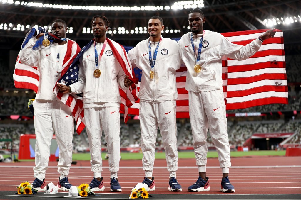 Gold medal winners Bryce Deadmon, Michael Cherry, Michael Norman and Rai Benjamin of Team United States celebrate with their medals after the Men's 4 x 400m Relay on day fifteen of the Tokyo 2020 Olympic Games at Olympic Stadium on Aug. 7, 2021 in Tokyo, Japan.