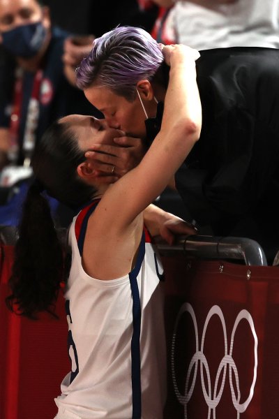 Megan Rapinoe and Sue Bird kiss after Bird's basketball game