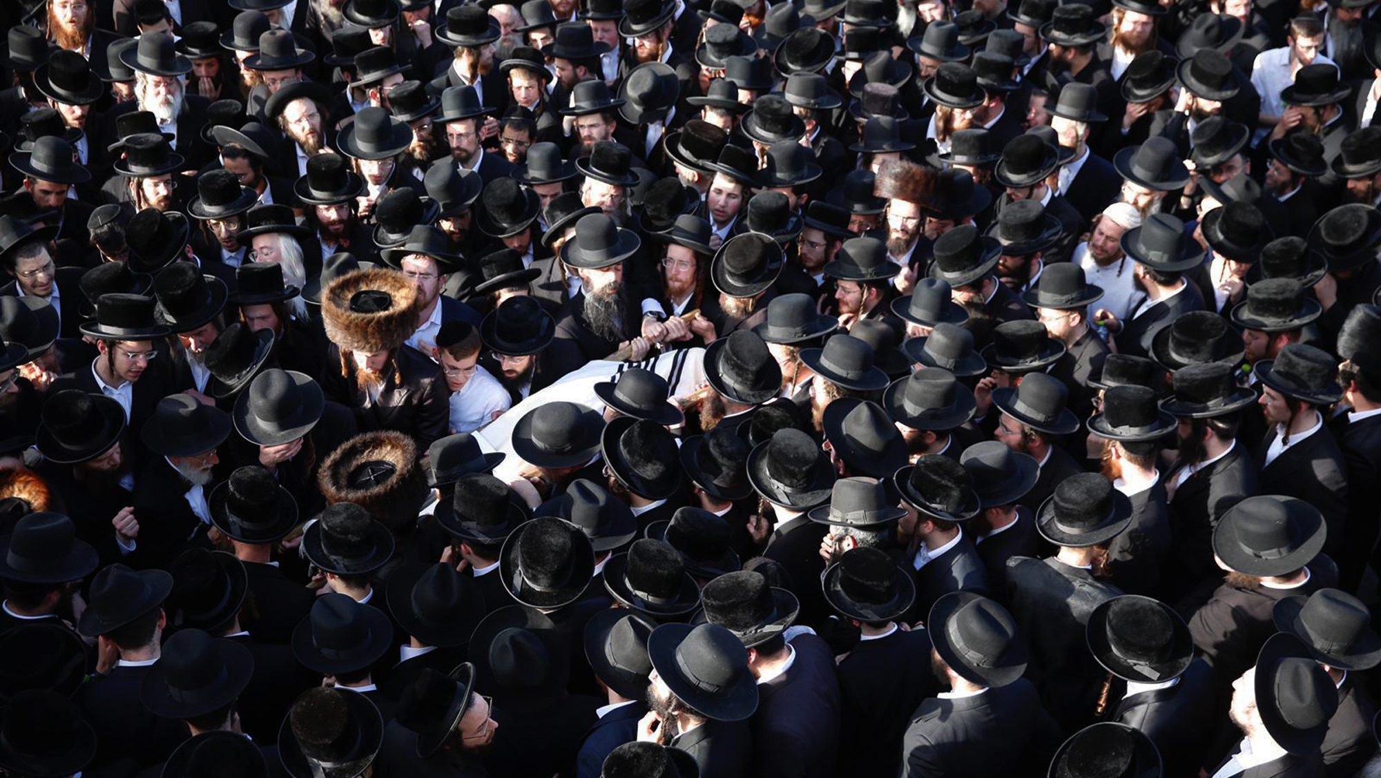 Mourners carry the body of Shragee Gestetner, a Canadian singer who died during Lag BaOmer celebrations at Mt. Meron in northern Israel, at his funeral in Jerusalem, April 30, 2021. A stampede at a religious festival attended by tens of thousands of ultra-Orthodox Jews in northern Israel killed dozens of people and injured about 150 others early Friday, medical officials said. It was one of the country's deadliest civilian disasters.