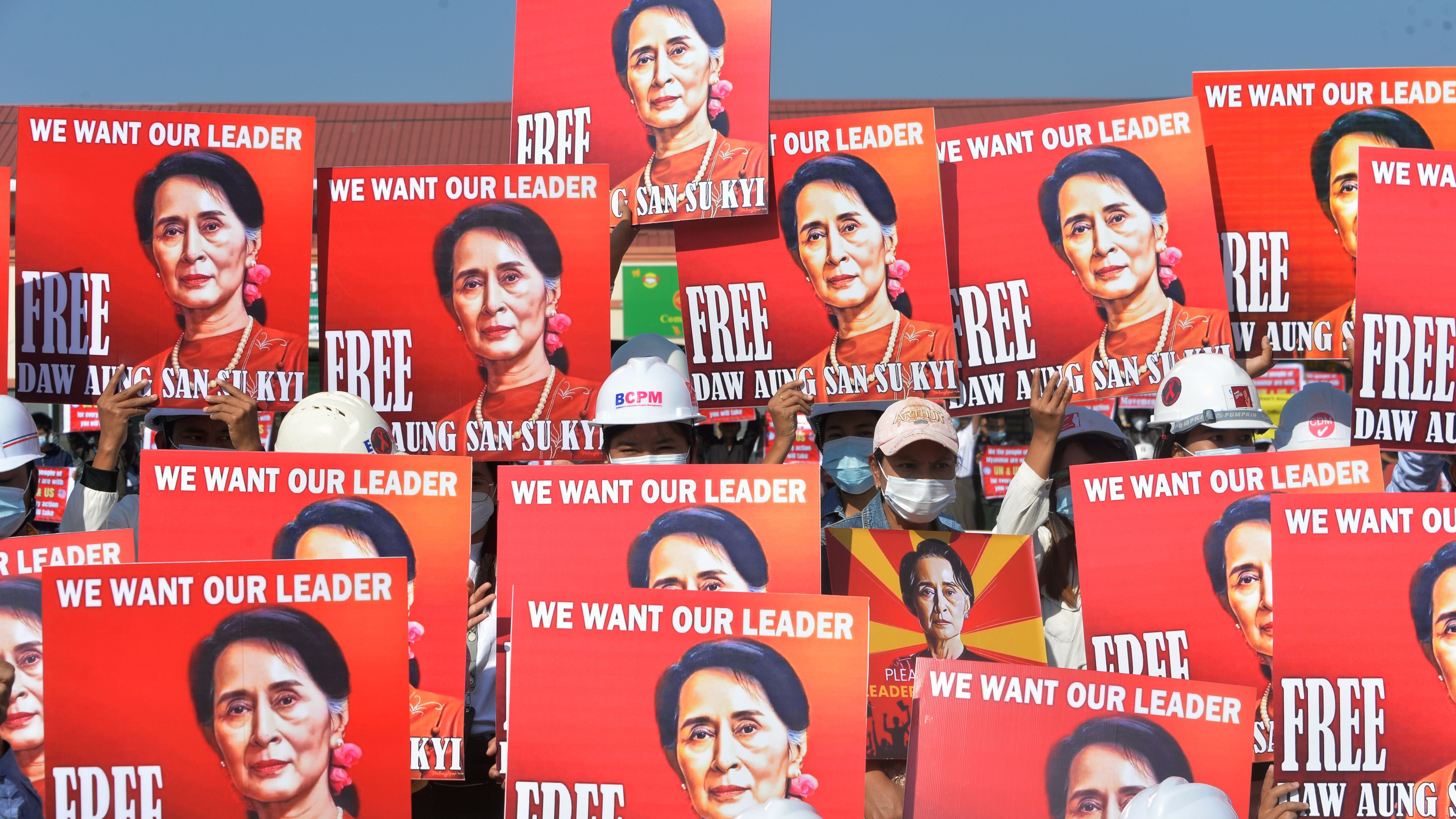 A group of protesting engineers hold up signs calling for the release of detained Myanmar civilian leader Aung San Suu Kyi during a rally against the country's military coup, Naypyidaw, Myanmar, Feb. 15, 2021.