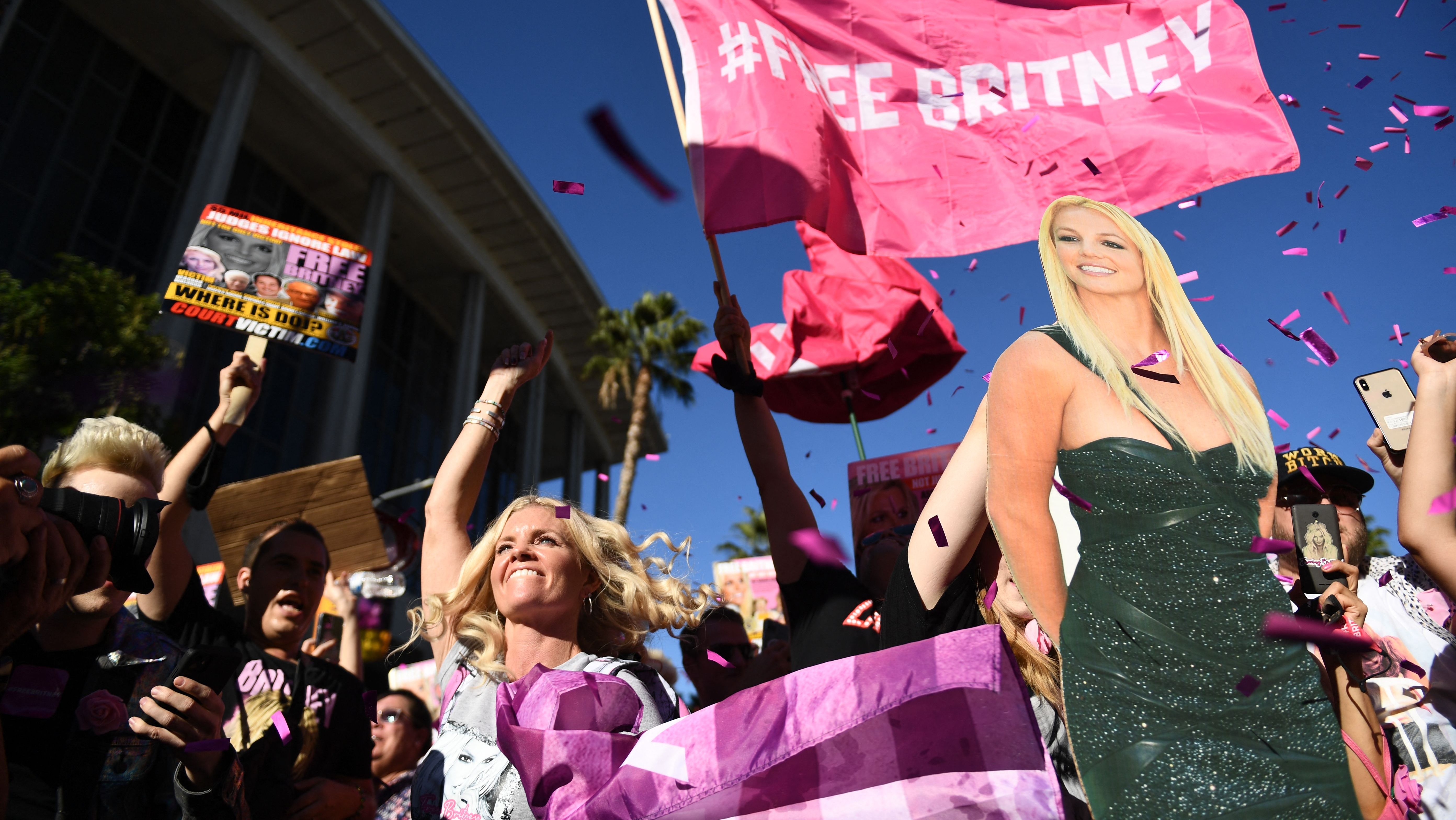 Supporters of the "Free Britney" movement rally in support of musician Britney Spears outside the Stanley Mosk courthouse in Los Angeles, California, Nov. 12, 2021. - A Los Angeles judge on Friday formally approved the process of ending the controversial guardianship that has controlled Spears' life for the past 13 years.
