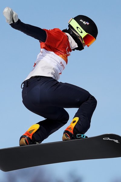 Snowboarder Faye Gulini performing a jump.