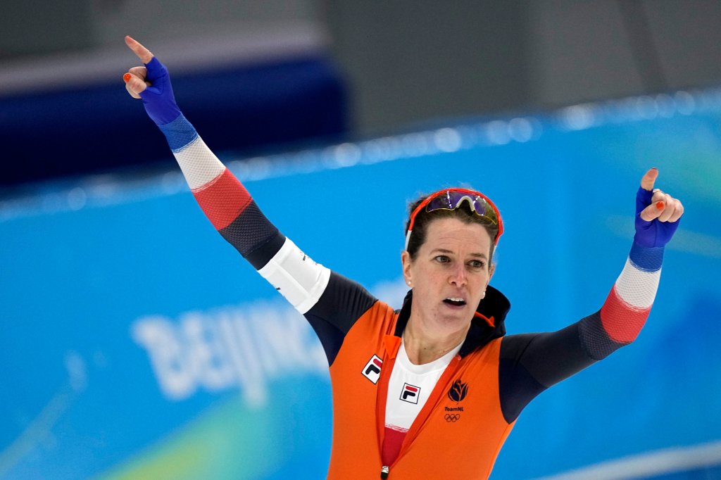 Ireen Wust of the Netherlands reacts after winning her heat and breaking an Olympic record in the women's speedskating 1,500-meter race