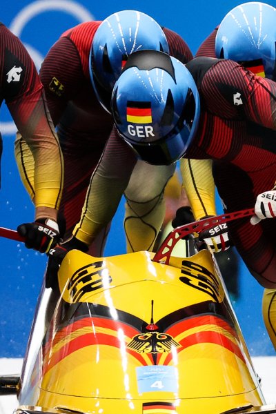 The German bobsled team going into a run.