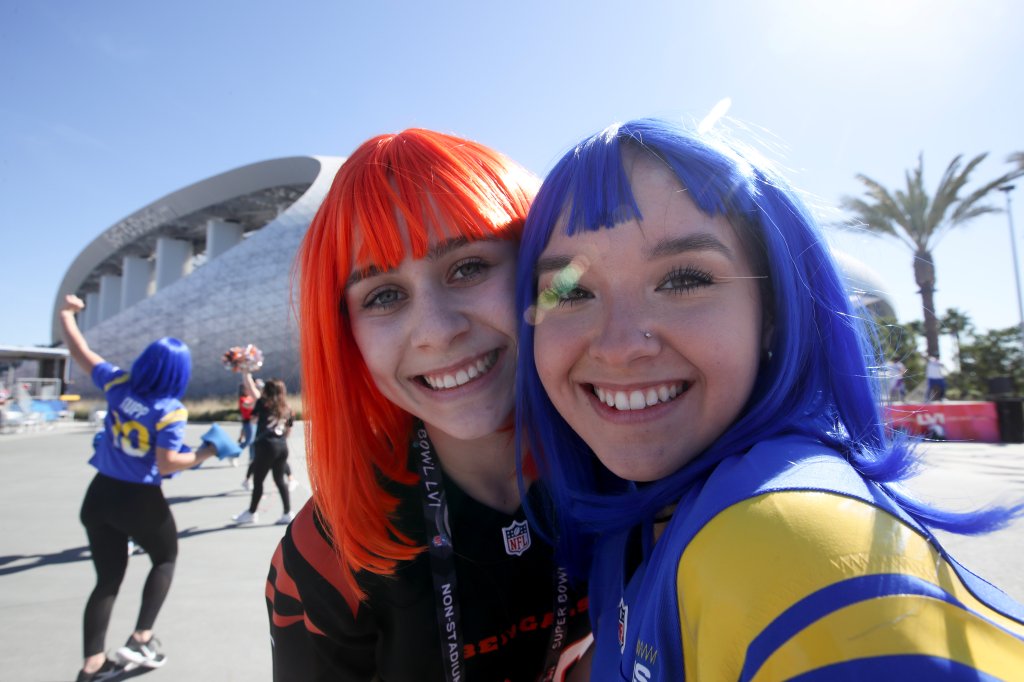 A Rams and Bengals fan poses