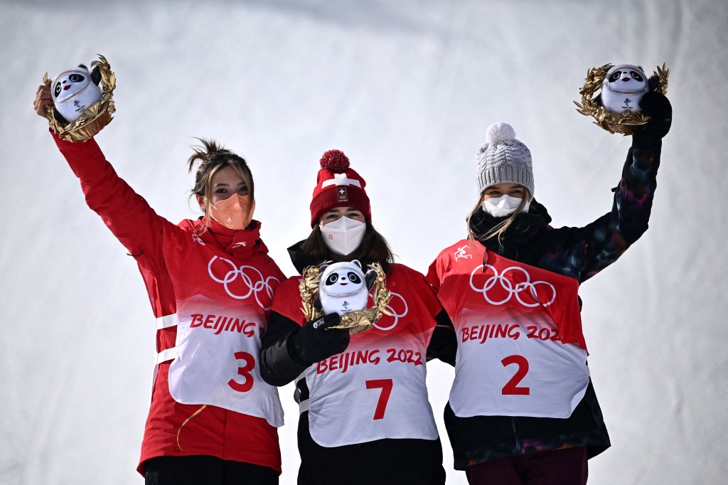 (From L to R) Silver medallist China's Eileen Gu, gold medallist Switzerland's Mathilde Gremaud and bronze medallist Estonia's Kelly Sildaru pose on the podium during the venue ceremony after the Freestyle Skiing Women's Freeski Slopestyle final run during the Beijing 2022 Winter Olympic Games at the Genting Snow Park H & S Stadium in Zhangjiakou, China on Feb. 15, 2022.