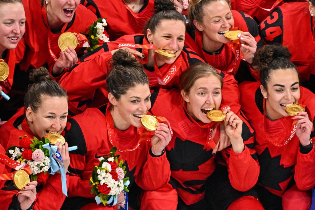 Gold medallist Canada team players celebrates gold at the victory ceremony for the gold medal Women's Ice Hockey match between Canada and the United States at the 2022 Winter Olympic Games, Feb. 17, 2022, in Beijing.