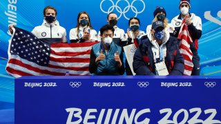 Nathan Chen of Team United States reacts with teammates following his skate in the Men's Single Skating Short Program Team Event during the Beijing 2022 Winter Olympic Games at Capital Indoor Stadium on February 04, 2022 in Beijing, China.