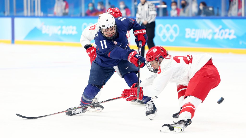 Forward Abby Roque #11 of Team USA takes a shot as forward Alexandra Vafina #29 of Team ROC defends in the first period during the women's preliminary match at Wukesong Sports Centre, Feb. 5, 2022 in Beijing, China.