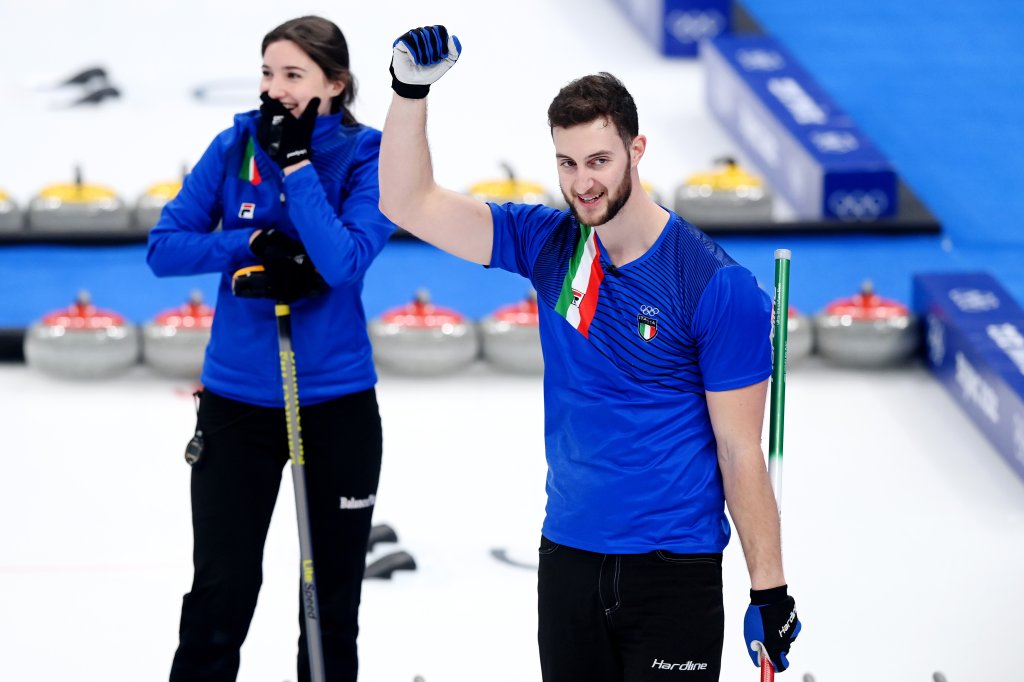 Amos Mosaner and Stefania Constantini of Team Italy celebrate winning the gold medal against Team Norway