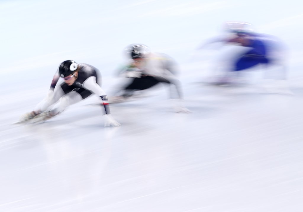 Kristen Santos of Team United States, Petra Jaszapati of Team Hungary and Cynthia Mascitto of Team Italy compete during the women's 1000m heats at the 2022 Winter Olympics, Feb. 9, 2022, in Beijing, China.