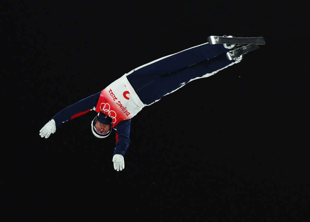 Justin Schoenefeld of Team United States in air during the Freestyle Skiing Mixed Team Aerials on Day 6 Beijing 2022 Winter Olympics Day of the at Genting Snow Park, Feb. 10, 2022 in Zhangjiakou, China. The US will advance to the team aerials final.