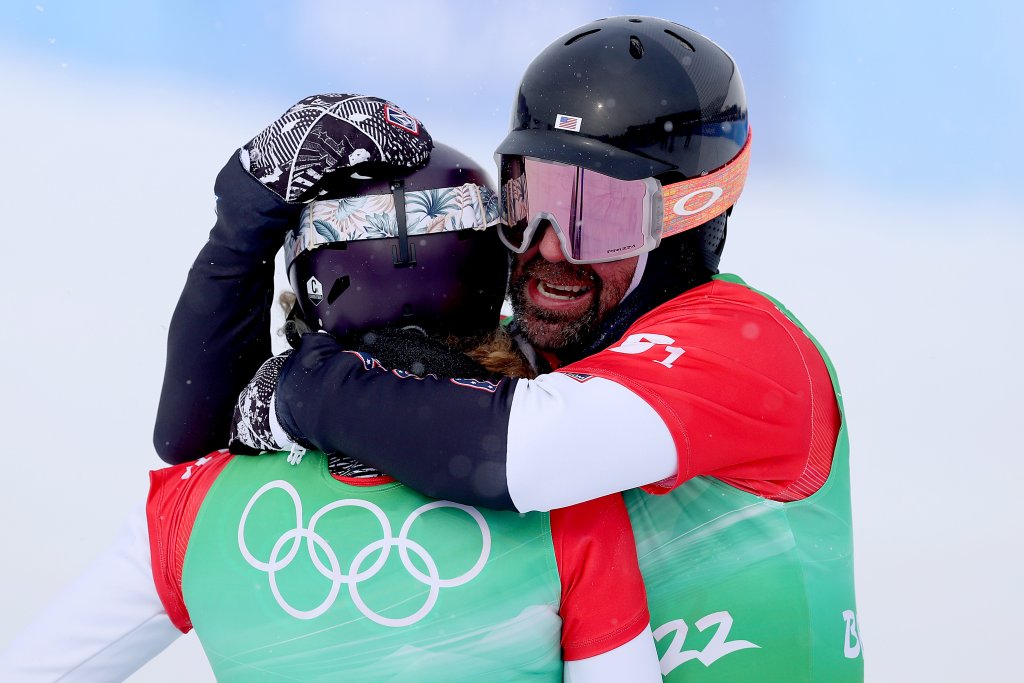 Lindsey Jacobellis of Team United States (L) and Nick Baumgartner of Team United States (R) celebrate winning the gold medal during the Snowboard Mixed Team Cross Big Final on day 8 of the 2022 Winter Olympics at Genting Snow Park on Feb. 12, 2022, in Zhangjiakou, China.