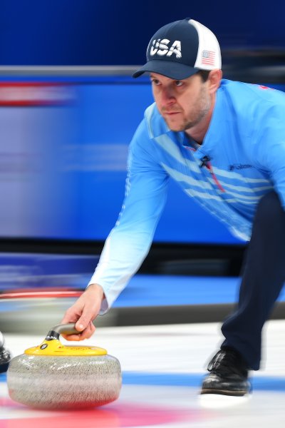 ohn Shuster of Team United States competes in curling