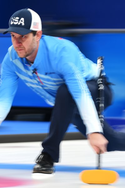 ohn Shuster of Team United States competes in curling