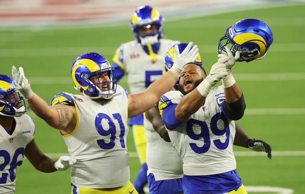 Aaron Donald #99 and Greg Gaines #91 of the Los Angeles Rams react