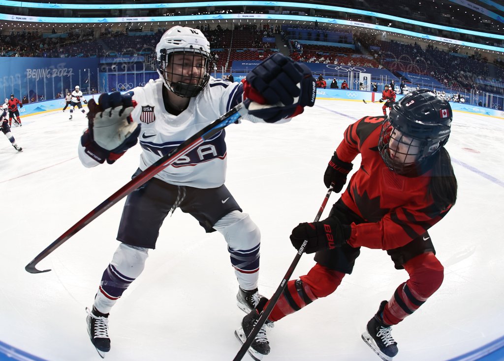 Jocelyne Larocque #3 of Team Canada and Jesse Compher #18 of Team United States compete during the Women's Ice Hockey Gold Medal match between Team Canada and Team United States at the 2022 Winter Olympic Games, Feb. 17, 2022, in Beijing, China. 