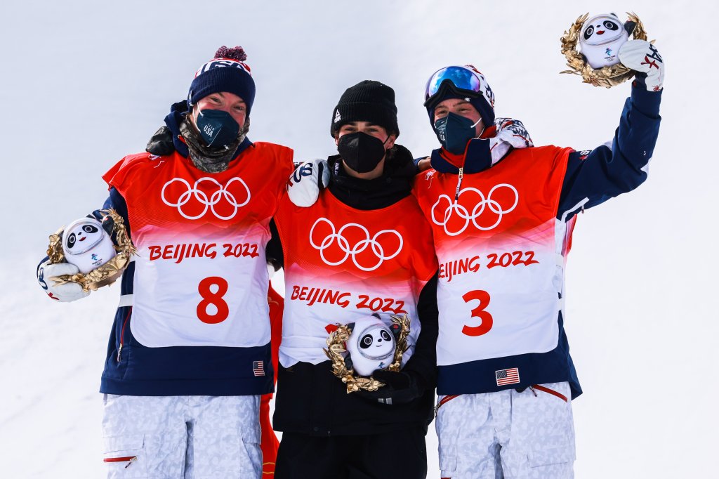 (L-R) Silver medalist David Wise of Team United States, gold medalist Nico Porteous of Team New Zealand and bronze medalist Alex Ferreira of Team United States celebrate during the Men's Freestyle Skiing Halfpipe flower ceremony on day 15 of the Beijing 2022 Winter Olympics at Genting Snow Park on Feb. 19, 2022, in Zhangjiakou, Hebei Province of China.