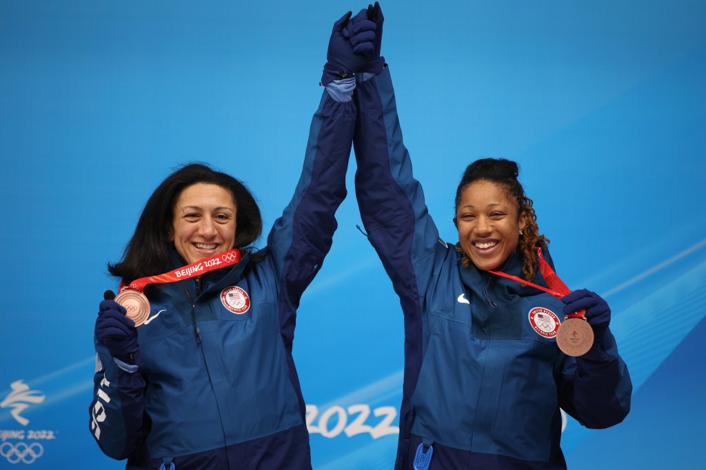 Bronze medal winners Elana Meyers Taylor and Sylvia Hoffman of Team United States celebrates their win following the 2-woman bobsled event at the 2022 Winter Olympic Games, Feb. 19, 2022, in Yanqing, China.