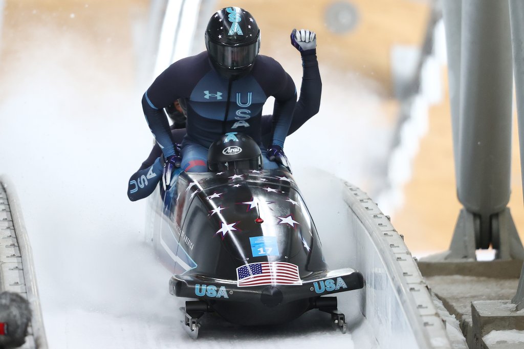 Frank Delduca, Carlo Valdes, James Reed and Hakeem Abdul-Saboor of Team United States react to their slide during the four-man Bobsleigh heat 4 on day 16 of 2022 Winter Olympics at National Sliding Centre on Feb. 20, 2022, in Yanqing, China.
