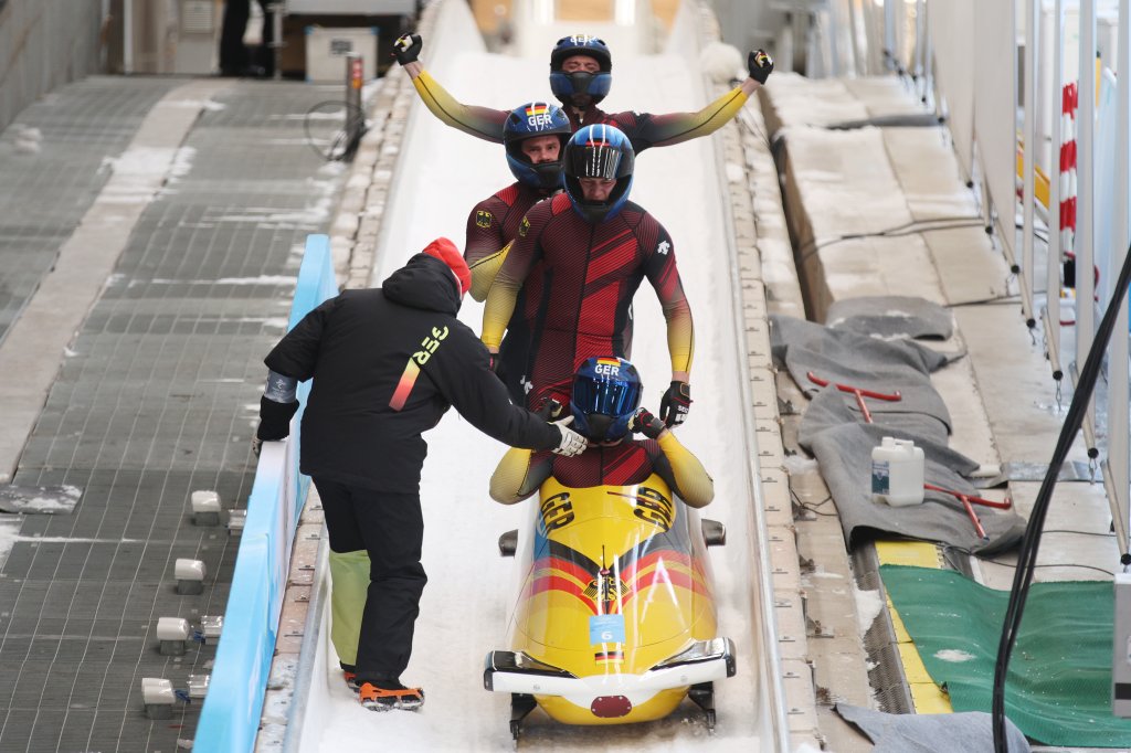 Johannes Lochner, Florian Bauer, Christopher Weber and Christian Rasp of Team Germany celebrate their silver medal finish in the four-man Bobsleigh heat 4 on day 16 of 2022 Winter Olympics at National Sliding Centre on Feb. 20, 2022, in Yanqing, China.