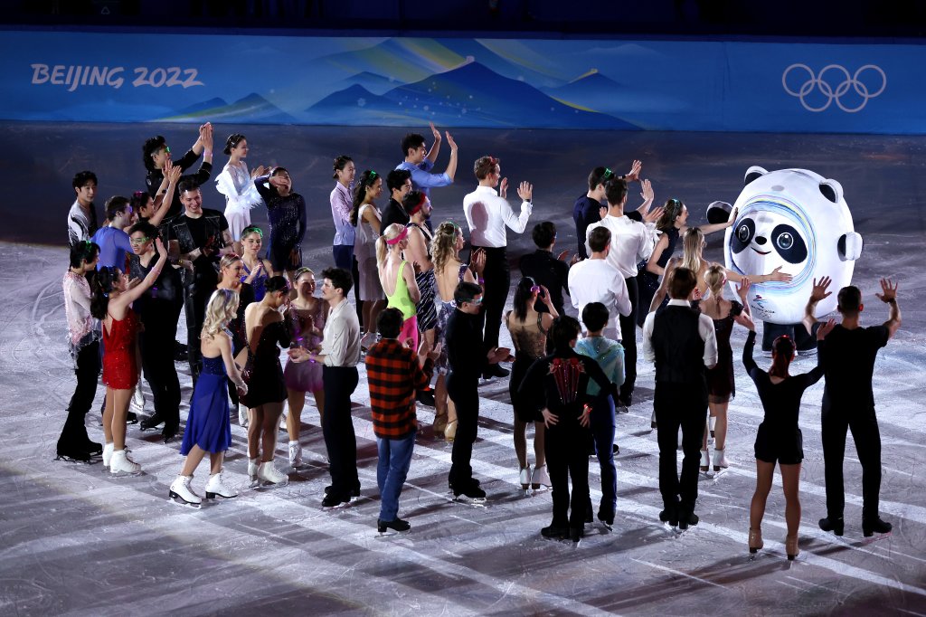 Competitors interact with mascot Bing Dwen Dwen following the Figure Skating Gala Exhibition on day 16 of the 2022 Winter Olympics at Capital Indoor Stadium on Feb. 20, 2022, in Beijing, China.